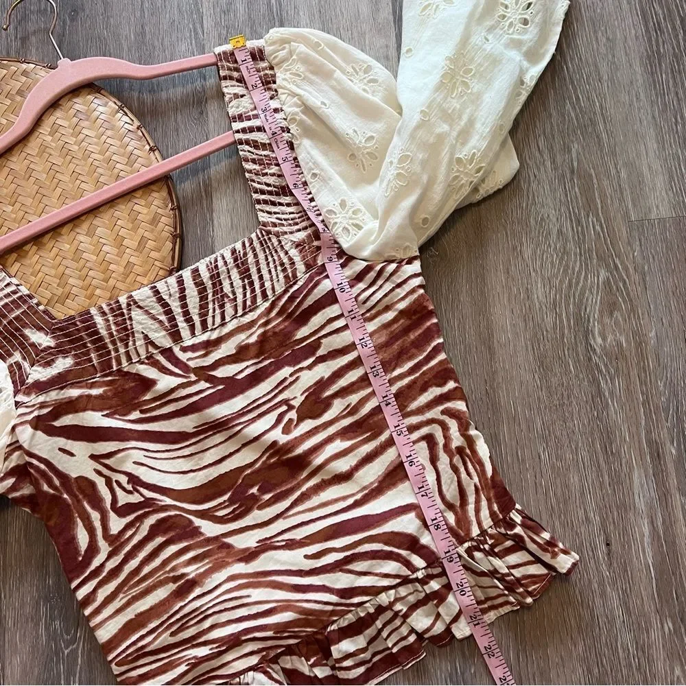 Anthropologie love the‎ label zebra laser cut puff sleeve smocked blouse